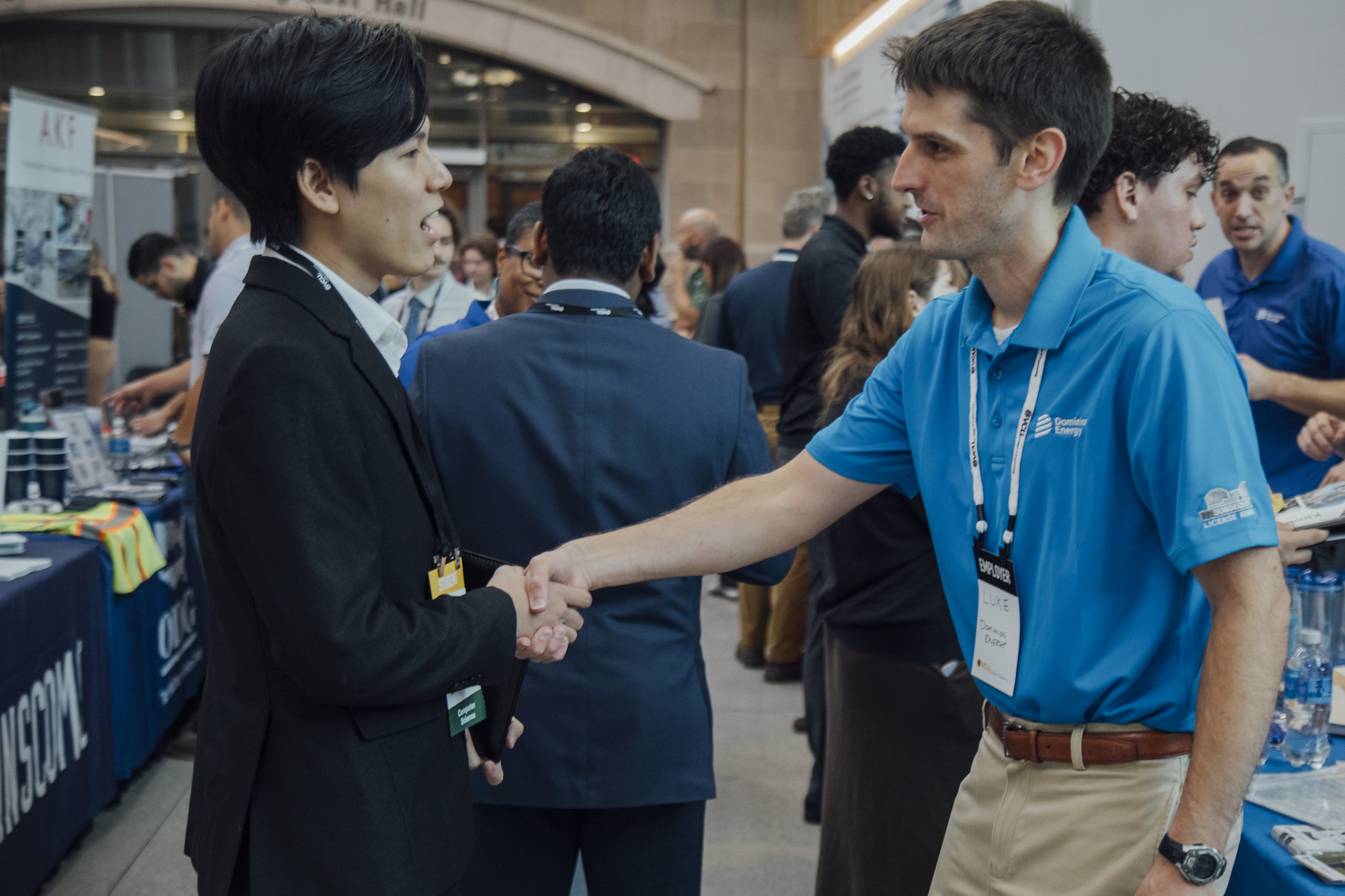 Student shaking hands with an employer